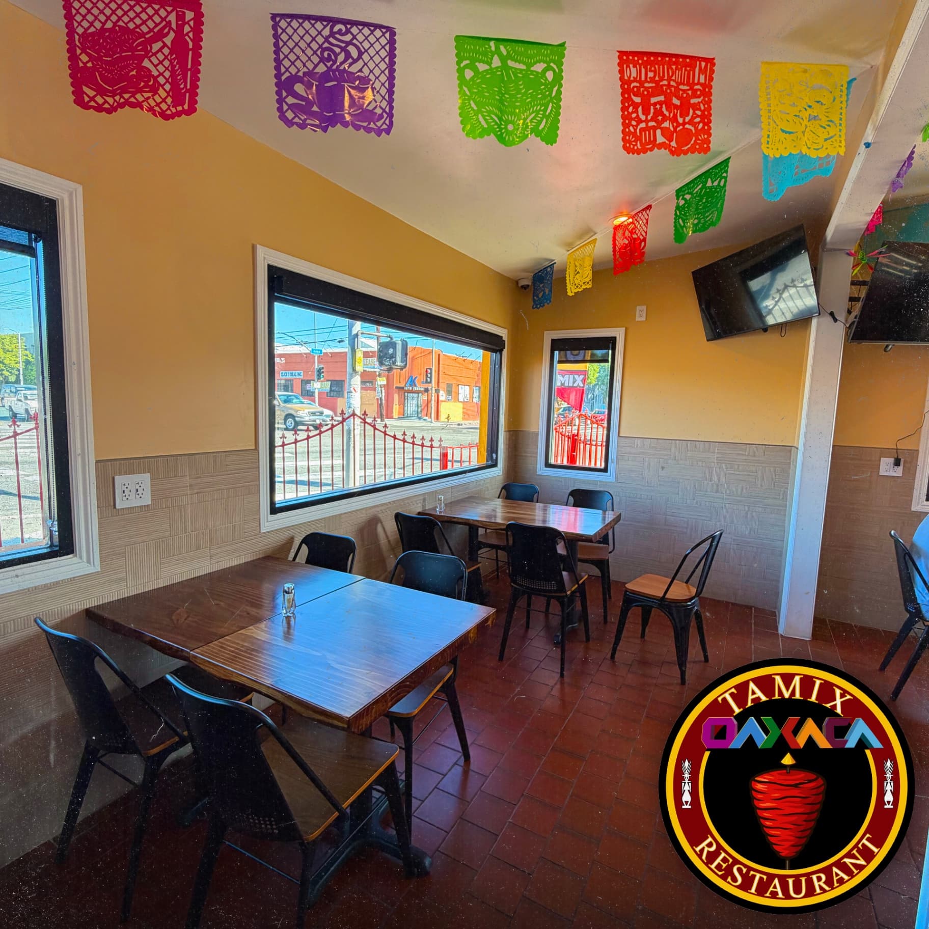Tamix Oaxaca Restaurant cozy interior dining room with authentic Mexican decor, comfortable seating arrangements, and warm atmosphere for traditional Oaxacan dining experience
