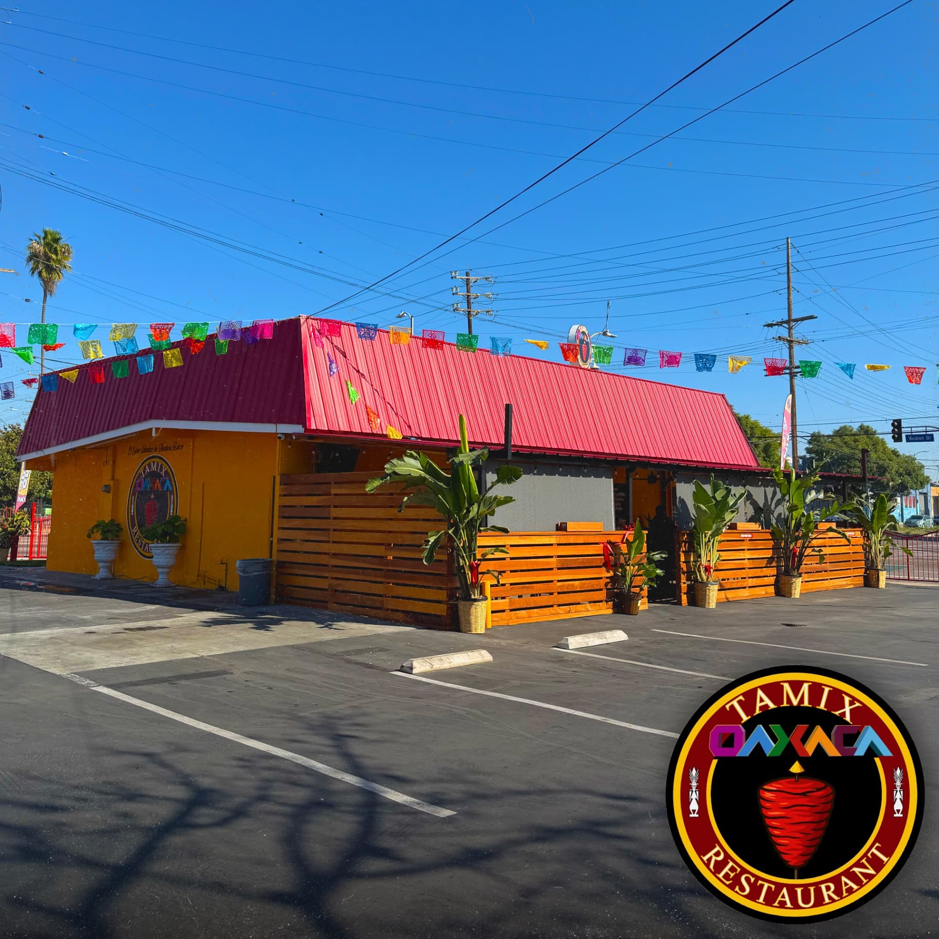 Tamix Oaxaca Restaurant exterior with parking lot, outdoor patio seating, and convenient access for families seeking authentic Mexican Oaxacan dining experience